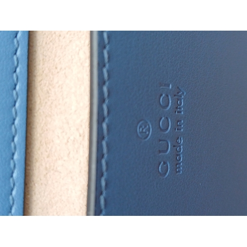 32 - A Gucci Blue Matelassé Leather GG Marmont Shoulder Bag. Blue matelassé leather exterior with silver-... 