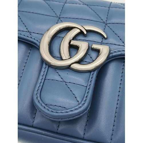 32 - A Gucci Blue Matelassé Leather GG Marmont Shoulder Bag. Blue matelassé leather exterior with silver-... 