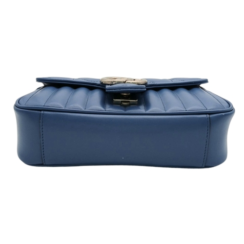 32 - A Gucci Blue Matelassé Leather GG Marmont Shoulder Bag. Blue matelassé leather exterior with silver-... 