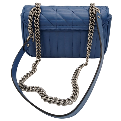 32 - A Gucci Blue Matelassé Leather GG Marmont Shoulder Bag. Blue matelassé leather exterior with silver-... 