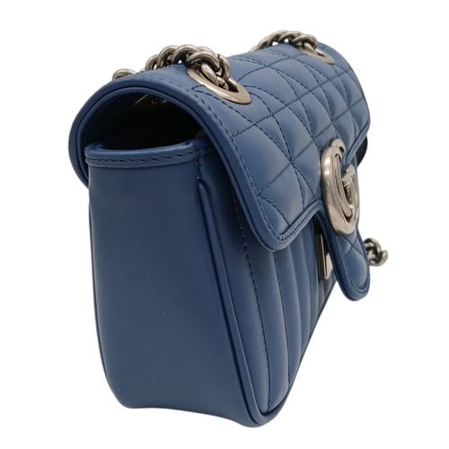 32 - A Gucci Blue Matelassé Leather GG Marmont Shoulder Bag. Blue matelassé leather exterior with silver-... 