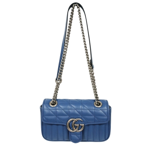 32 - A Gucci Blue Matelassé Leather GG Marmont Shoulder Bag. Blue matelassé leather exterior with silver-... 