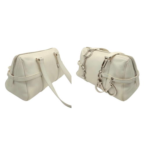 375 - A Christian Dior White Leather Shoulder Bag. White grained leather exterior with silver-toned hardwa... 