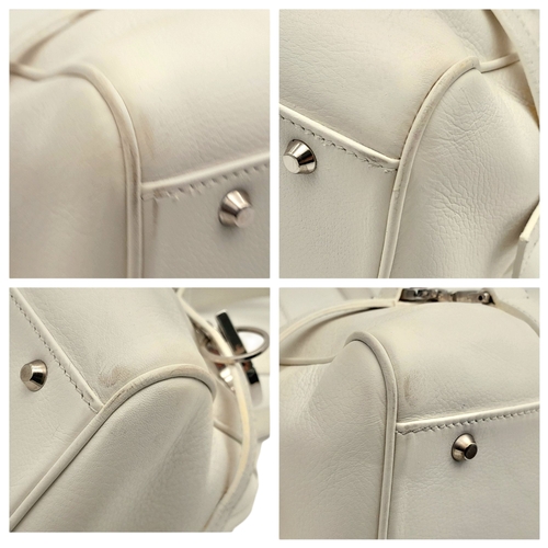 375 - A Christian Dior White Leather Shoulder Bag. White grained leather exterior with silver-toned hardwa... 