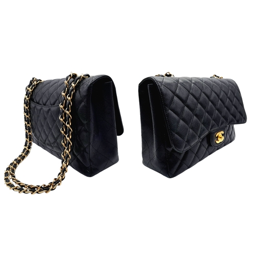 4 - A Chanel Black Caviar Leather Jumbo Classic Flap Bag. Black  caviar leather exterior with gold-toned... 