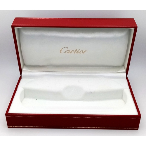 438 - A Pair of Designer Cartier Eyeglasses. Comes with pouch, extra Cartier box, case, certificate and ex... 