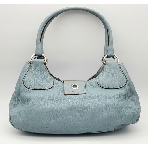 445 - A Prada Light Blue Leather Shoulder Bag. Light blue pebbled leather exterior with gold-toned hardwar... 