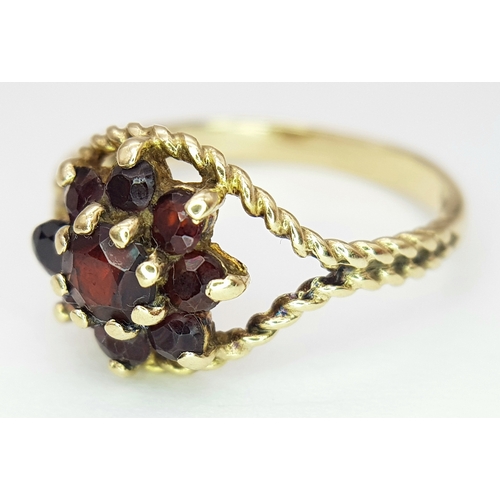 500 - A Vintage Hallmarked 1979 9 Carat Yellow Gold Garnet Cluster Ring Size O. The Ring Measures 1cm wide... 