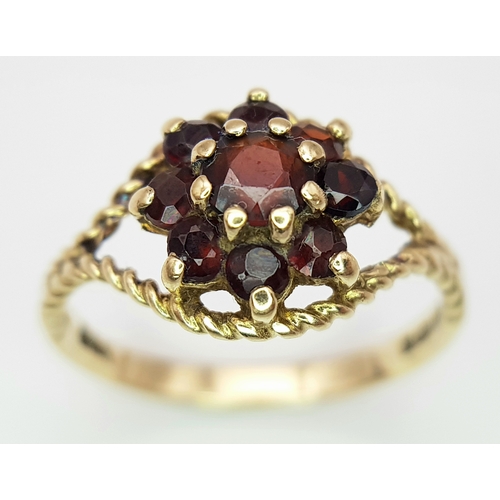 500 - A Vintage Hallmarked 1979 9 Carat Yellow Gold Garnet Cluster Ring Size O. The Ring Measures 1cm wide... 