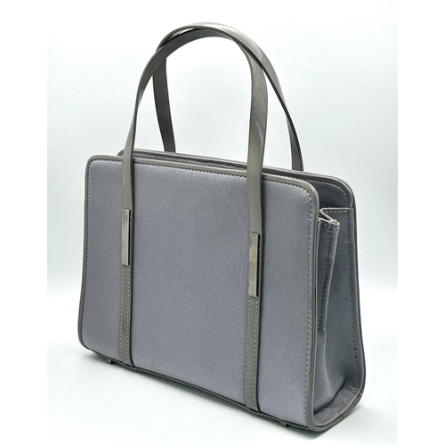 508 - A Small Gucci Grey Satin and Leather Handbag. Silver tone hardware. 16cm height. 21cm length. Textil... 