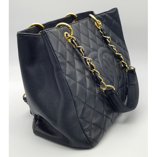 94 - A Chanel Black Caviar Leather Tote Bag. Black diamond-quilted caviar leather exterior with gold-tone... 