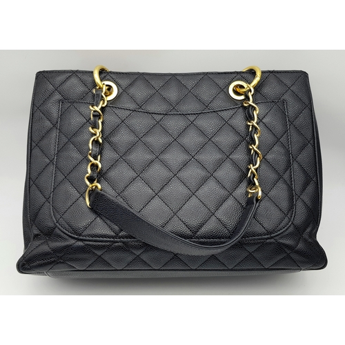 94 - A Chanel Black Caviar Leather Tote Bag. Black diamond-quilted caviar leather exterior with gold-tone... 