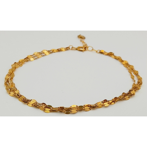 14 - Incredibly Pretty 9 CARAT GOLD TRIPLE STRAND BRACELET. Full UK Hallmark. 1.2 grams. 19 cm.