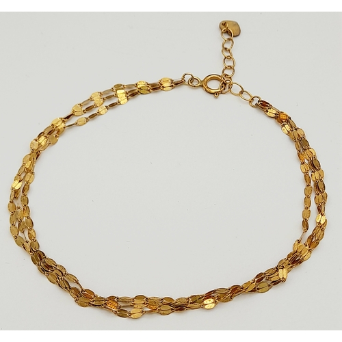 14 - Incredibly Pretty 9 CARAT GOLD TRIPLE STRAND BRACELET. Full UK Hallmark. 1.2 grams. 19 cm.