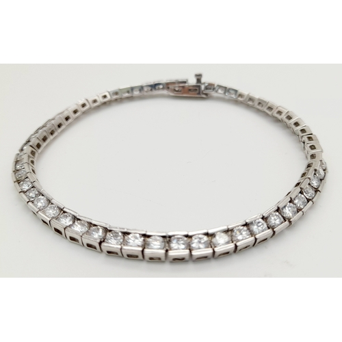 238 - Beautiful SILVER and ZIRCONIA TENNIS BRACELET. Having 54 Round Cut sparkling Zirconia Gemstones indi... 