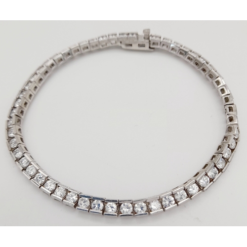 238 - Beautiful SILVER and ZIRCONIA TENNIS BRACELET. Having 54 Round Cut sparkling Zirconia Gemstones indi... 