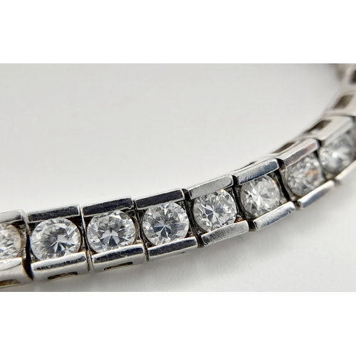 238 - Beautiful SILVER and ZIRCONIA TENNIS BRACELET. Having 54 Round Cut sparkling Zirconia Gemstones indi... 