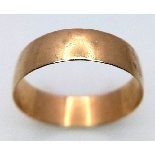 296 - A 9K Yellow Gold Band Ring - Full UK Hallmarks. 7mm. Size X. 2.34g