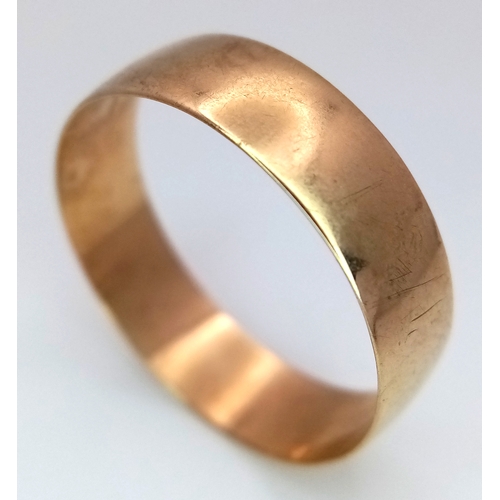 296 - A 9K Yellow Gold Band Ring - Full UK Hallmarks. 7mm. Size X. 2.34g