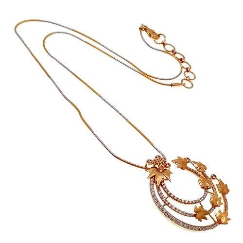 297 - AN 18K YELLOW GOLD DIAMOND AND LEAF PENDANT (0.45CT DIAMOND WEIGHT) ON 14K 2-TONE SNAKE CHAIN,  9.6G... 