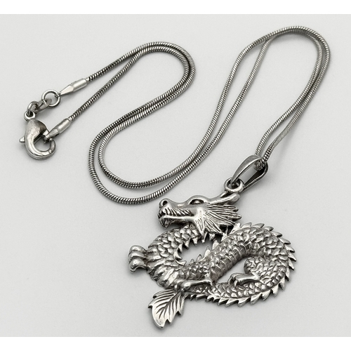 420 - 2 x Beautiful SILVER PENDANTS mounted on SILVER CHAINS. To include a DRAGON PENDANT having  intricat... 