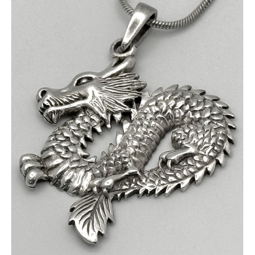 420 - 2 x Beautiful SILVER PENDANTS mounted on SILVER CHAINS. To include a DRAGON PENDANT having  intricat... 