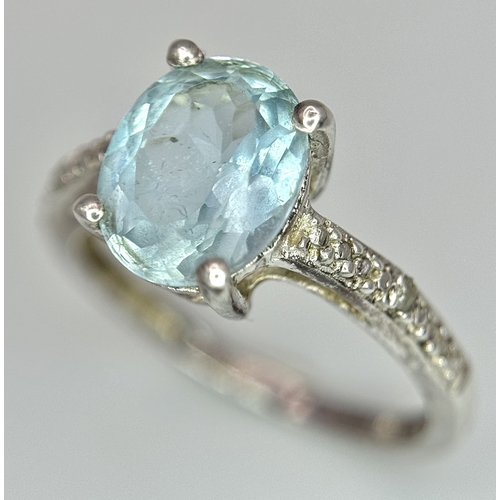 497 - An  Exquisite AQUAMARINE and DIAMOND, SILVER RING. Consisting a 1 CARAT OVAL CUT AQUAMARINE Mounted ... 