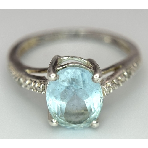 497 - An  Exquisite AQUAMARINE and DIAMOND, SILVER RING. Consisting a 1 CARAT OVAL CUT AQUAMARINE Mounted ... 