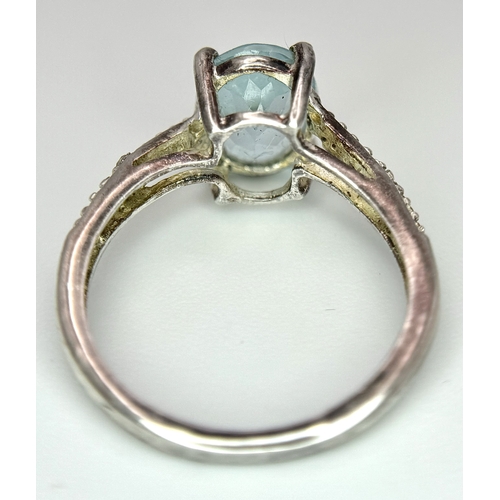 497 - An  Exquisite AQUAMARINE and DIAMOND, SILVER RING. Consisting a 1 CARAT OVAL CUT AQUAMARINE Mounted ... 