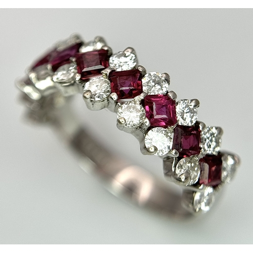 51 - A Stunning 18K White Gold Ruby and Diamond Ring. A row of 1ctw rubies surrounded either side by 1.2c... 