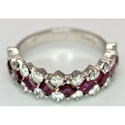 51 - A Stunning 18K White Gold Ruby and Diamond Ring. A row of 1ctw rubies surrounded either side by 1.2c... 