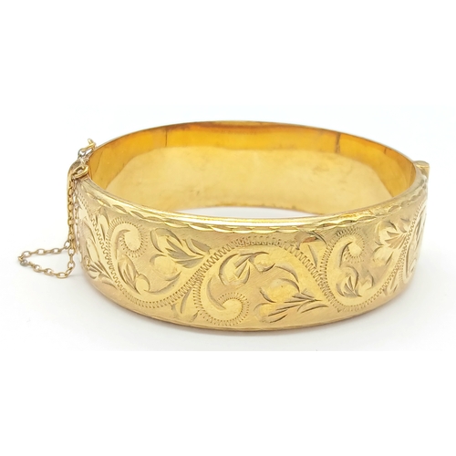 56 - Fabulous vintage Hinged 9 CARAT ROLLED GOLD BANGLE. Complete with safety chain. Beautifully decorate... 