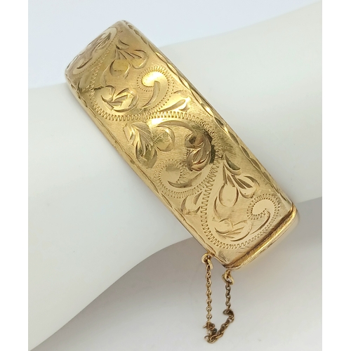 56 - Fabulous vintage Hinged 9 CARAT ROLLED GOLD BANGLE. Complete with safety chain. Beautifully decorate... 