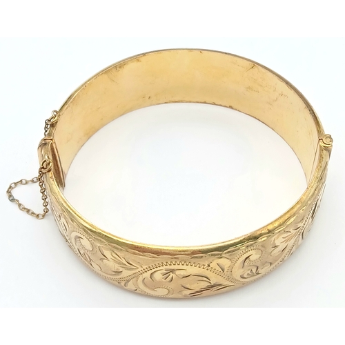 56 - Fabulous vintage Hinged 9 CARAT ROLLED GOLD BANGLE. Complete with safety chain. Beautifully decorate... 