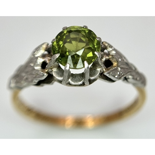 70 - A Fabulous Vintage EMERALD RING, SET IN 18 CARAT GOLD and PLATINUM. Consisting a round cut EMERALD t... 