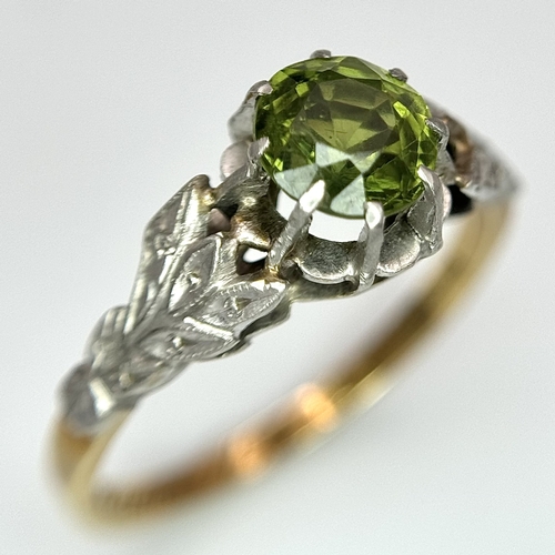 70 - A Fabulous Vintage EMERALD RING, SET IN 18 CARAT GOLD and PLATINUM. Consisting a round cut EMERALD t... 