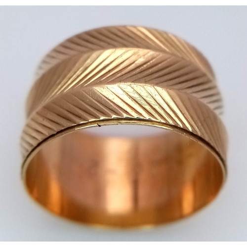 8 - A Vintage 9K Yellow Gold Band Ring. Geometric decoration. 12mm width. Size P. 5g.