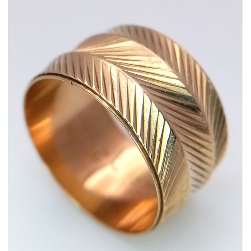 8 - A Vintage 9K Yellow Gold Band Ring. Geometric decoration. 12mm width. Size P. 5g.
