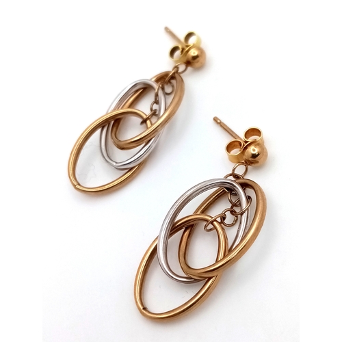 1358 - A pair of 9k gold, two tone oval drop earrings, 2.6g total weight. 1780I