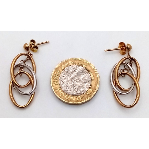 1358 - A pair of 9k gold, two tone oval drop earrings, 2.6g total weight. 1780I