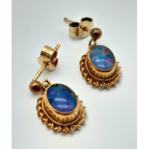 155 - A Pair of Vintage 9K Yellow Gold Opal Earrings. Opal cabochons with excellent colour-play. 1.7g