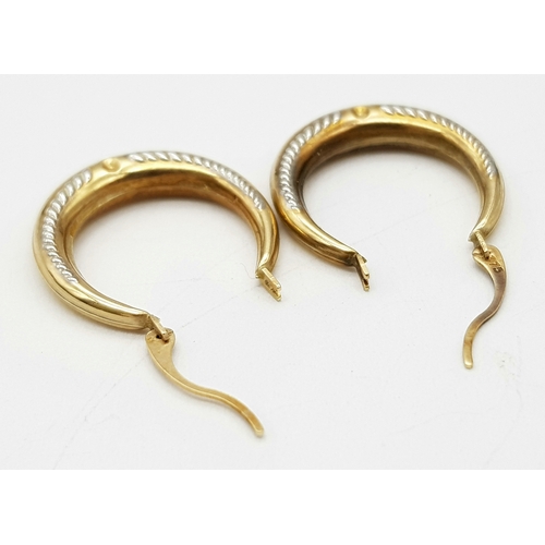 261 - A Pair of 9K Yellow Gold Small Creole Hoop Earrings. 2cm. 0.8g