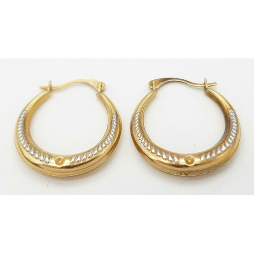 261 - A Pair of 9K Yellow Gold Small Creole Hoop Earrings. 2cm. 0.8g