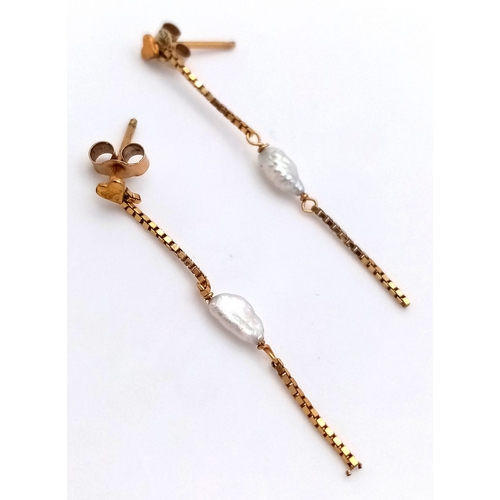 491 - A Pair of 9K Yellow Gold, Rice Pearl Drop Earrings. 3.5cm. 0.66g