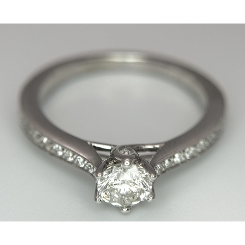 19 - AN 18K WHITE GOLD DIAMOND SET 2 PIECE RING. A SET SOLITAIRE WITH DIAMOND SHOULDERS AND SHAPED DIAMON... 