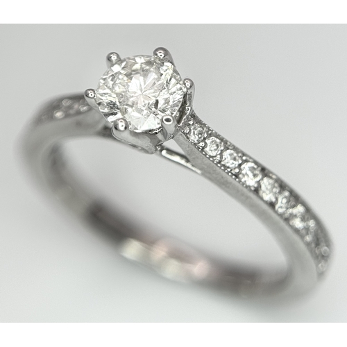 19 - AN 18K WHITE GOLD DIAMOND SET 2 PIECE RING. A SET SOLITAIRE WITH DIAMOND SHOULDERS AND SHAPED DIAMON... 