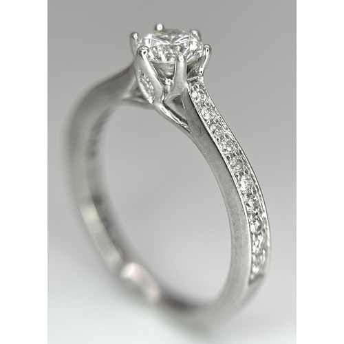 19 - AN 18K WHITE GOLD DIAMOND SET 2 PIECE RING. A SET SOLITAIRE WITH DIAMOND SHOULDERS AND SHAPED DIAMON... 