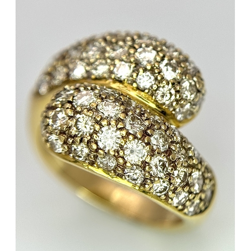 1400 - A WGI Certified 18K Yellow Gold Diamond Crossover Ring set with 64 Round Cut Brilliant Diamonds. 1.5... 