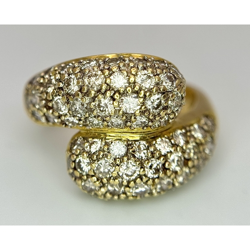 1400 - A WGI Certified 18K Yellow Gold Diamond Crossover Ring set with 64 Round Cut Brilliant Diamonds. 1.5... 