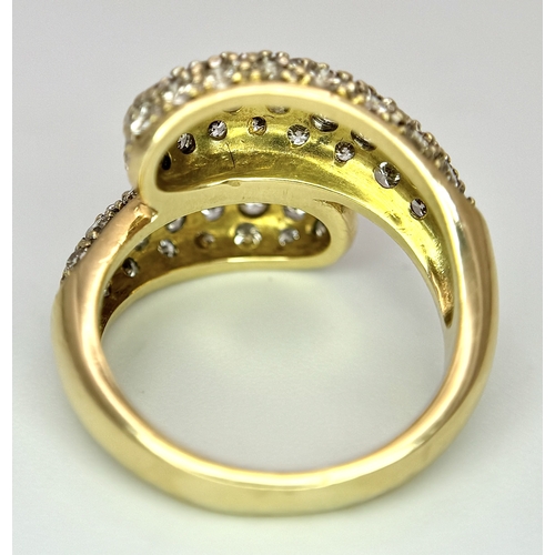 1400 - A WGI Certified 18K Yellow Gold Diamond Crossover Ring set with 64 Round Cut Brilliant Diamonds. 1.5... 